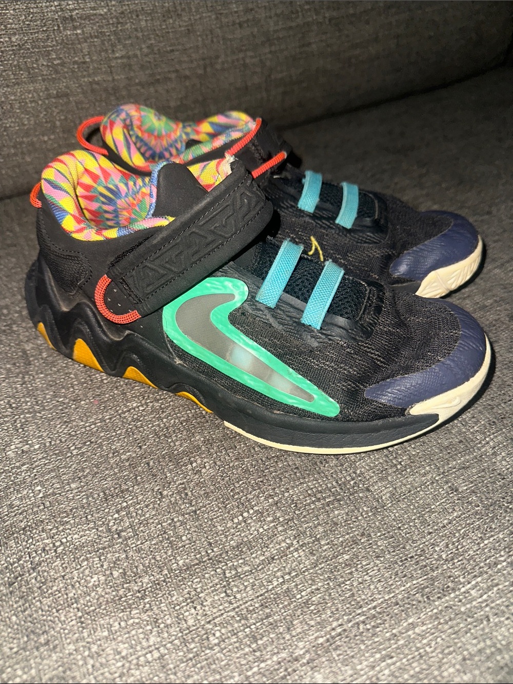 Nike Kids Black Sneakers with Teal Swoosh and Blue Straps